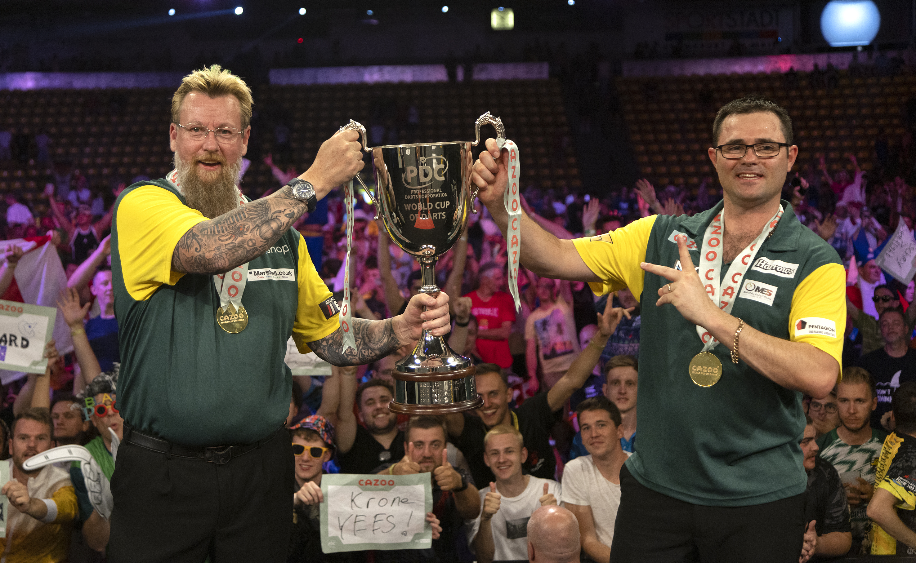 Simon Whitlock and Damon Heta lift the World Cup of Darts for Australia