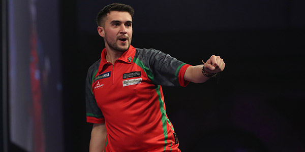 Jamie Lewis celebrates defeating Peter Wright (Lawrence Lustig, PDC)