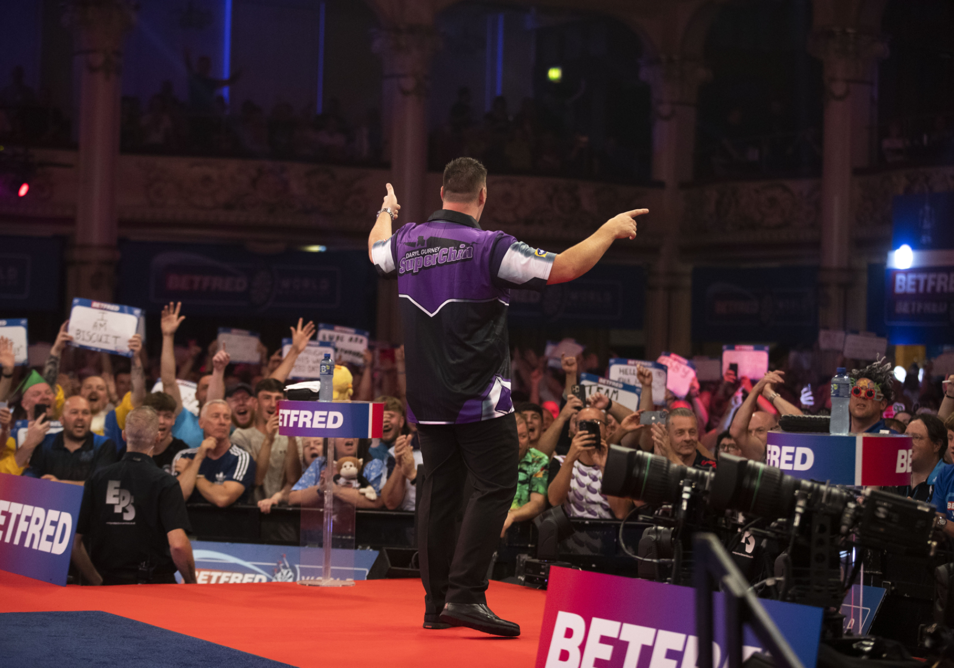 Daryl Gurney entertains the crowd during his walk-on