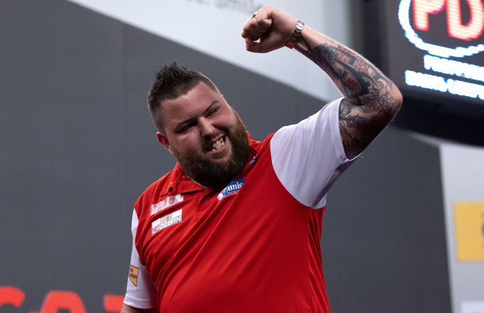 Michael Smith celebrates at the 2022 World Cup of Darts