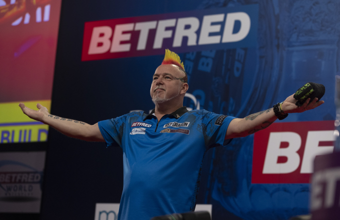 Peter Wright dances across stage at the 2021 World Matchplay