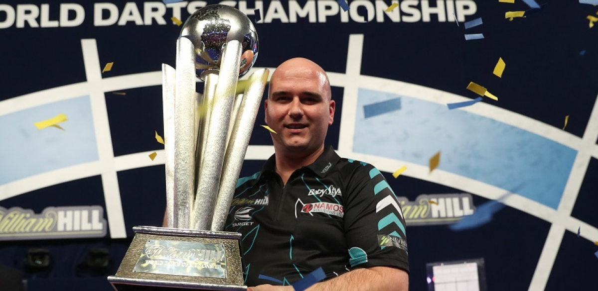 Rob Cross holding World Championship trophy (Lawrence Lustig, PDC)