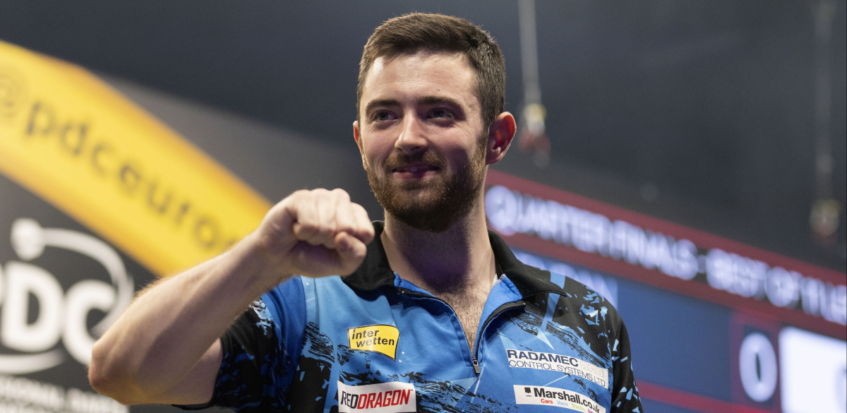 Luke Humphries celebrates winning a match at European Darts Grand Prix