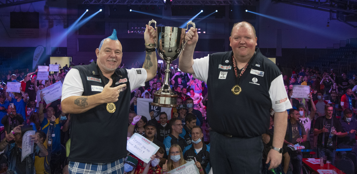 Peter Wright and John Henderson lift the World Cup title in 2021