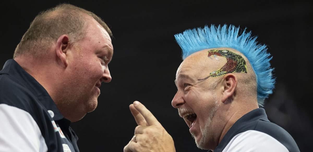 Peter Wright and John Henderson celebrate at the Cazoo World Cup