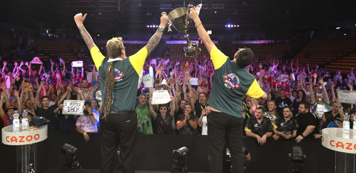 Simon Whitlock and Damon Heta lift the World Cup of Darts for Australia