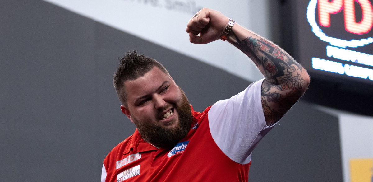 Michael Smith celebrates at the 2022 World Cup of Darts