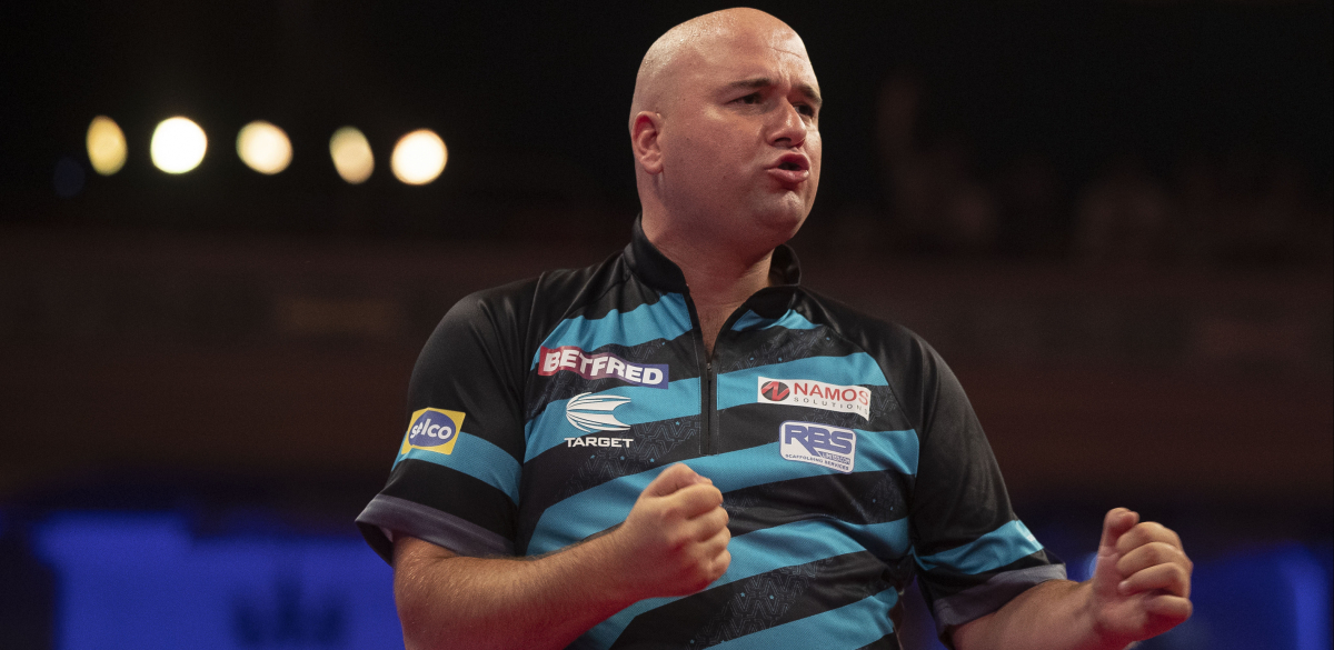 Rob Cross celebrates his win over Chris Dobey