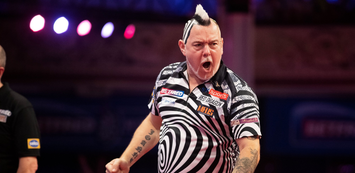 Peter Wright celebrates his tie-break win over Krzysztof Ratajski