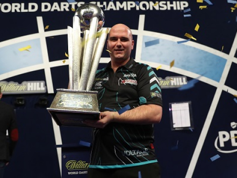 Rob Cross holding World Championship trophy (Lawrence Lustig, PDC)