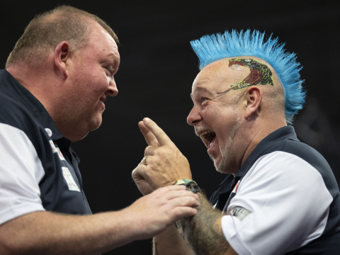 Peter Wright and John Henderson celebrate at the Cazoo World Cup