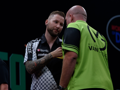 Danny Noppert shakes hands with Michael van Gerwen in Amsterdam