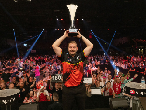 Dimitri Van den Bergh lifts the Nordic Darts Masters trophy