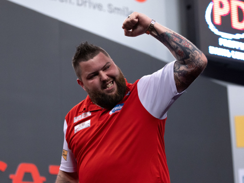 Michael Smith celebrates at the 2022 World Cup of Darts