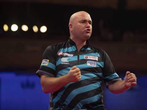 Rob Cross celebrates his win over Chris Dobey