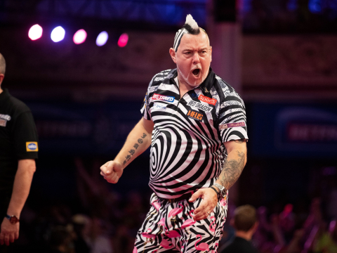 Peter Wright celebrates his tie-break win over Krzysztof Ratajski