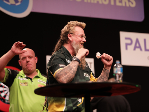 Simon Whitlock celebrates his win over Michael van Gerwen (PDC)