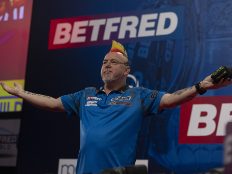 Peter Wright dances across stage at the 2021 World Matchplay
