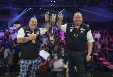 Peter Wright and John Henderson lift the World Cup title in 2021