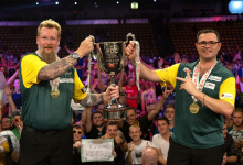 Simon Whitlock and Damon Heta lift the 2022 World Cup trophy