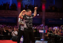 Price celebrates his nine-darter against Danny Noppert